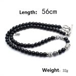 Collar elegante de ónix negro con 4 cuentas de ojo de tigre y cierre en acero inoxidable. Diseño unisex ideal para estilo diario o como regalo significativo.