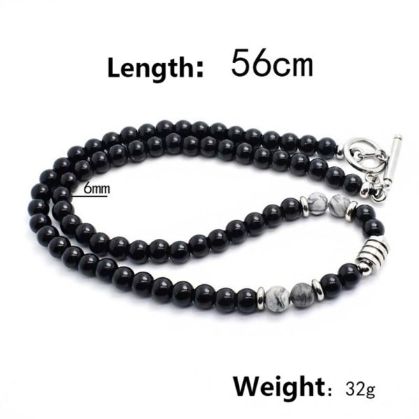 Collar elegante de ónix negro con 4 cuentas de ojo de tigre y cierre en acero inoxidable. Diseño unisex ideal para estilo diario o como regalo significativo.